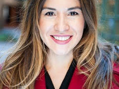 women in a red shirt smiling