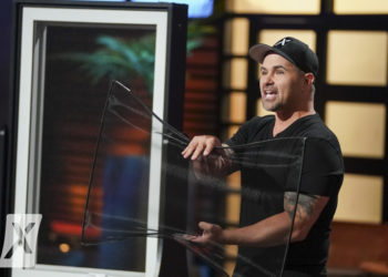 man holding a screen