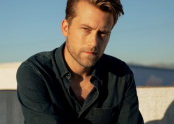 White man staring intently at the camera