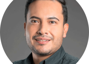 smiling hispanic man in a headshot