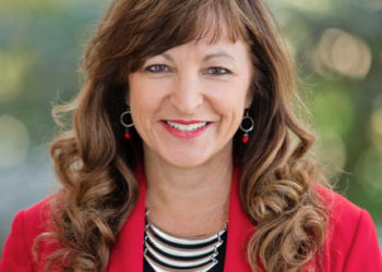 white woman in a red jacket