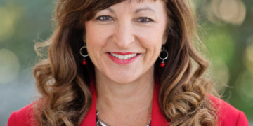 white woman in a red jacket