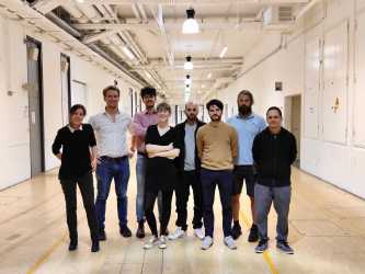 Group of young professionals in a hallway