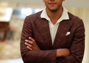 Black man in a brown jacket