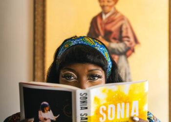 Black woman reading a book