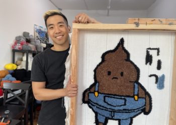 man in front of a tufted rug