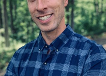 White man in checked shirt