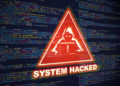 a red triangle with the words System Hacked on it